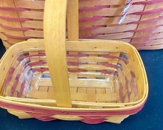 Lot 1111. Buy it Now $72.00  4 Longaberger basket assortment.  1990 handled basket with red ticking liner, 1994 med curved handle basket, 1998 small curved handle basket, 1998 round Dresden tour basket. Lg 1990 16x13x11, 1994  basket 9x5x5, 1998 basket 8x5x3, Dresden tour 8' round 6.5" tall,  $72