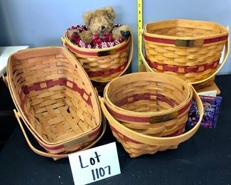 Lot 1107.   Buy it Now $60.00  4 pc Longaberger Baskets + 1 bear.  Christmas Collection.  Yuletides Collection 1991, Glad Tidings Basket w/Liner and candy cane fabric 1998., Snowflake Basket 1997, Jingle Bell Basket 1994. Wooden Stand NOT INCLUDED.  