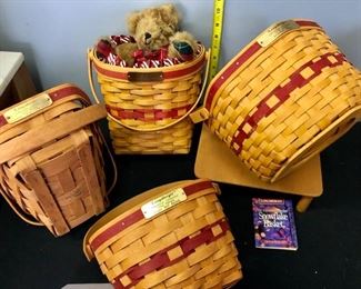 Lot 1107  Buy it Now $60.00  4 pc Longaberger Baskets + 1 bear.  Christmas Collection.  Yuletides Collection 1991, Glad Tidings Basket w/Liner and candy cane fabric 1998., Snowflake Basket 1997, Jingle Bell Basket 1994. Wooden Stand NOT INCLUDED.   