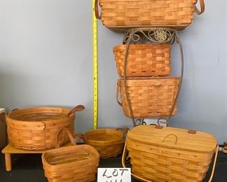 Lot 1114. Buy it Now $90.00  A big Lot of Longaberger Baskets (7 pc): Round w/2 leather handles (as is) 1989 10" dia. One handle wall hanger (1991, 9x5x5), leather double handle cute round basket (7"x3.5"), small leather handle wall hanging 1991 (7x5x4" w/liner), rectangle 14x8x4.5" w/ leather handles 1992. Wooden top rectangle liner 10"x6"7" one handle 1991, one handle fastener basket w/liner 1992 (11x8x6).  ALL STANDS/PLATFORMS NOT INCLUDED (just props for getting the photos). 