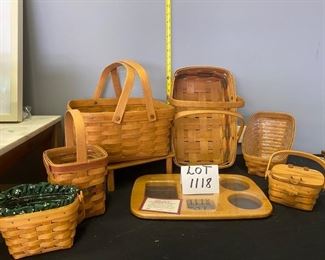 Lot 1118 Buy it Now $100.00   Lot of 6 Longaberger baskets, plus 1 new woodcrafts "road trip" lid.  Liners and protectors included as pictured. Stand not included.  Road Trip Lid (14.5x9"), Square 2 handled basket (12"x7"h, 1995), American Cancer Society small basket w/liner (6x4x4, 1997), one handled utensil basket w/green and red trim (5.5x6", 1995), small 1 handled basket with wood lid (5"sq, 3"h, 1990), 2 handled colorful gathering basket (9x14x4", 1991), Angled veggie basket w/liner (9x11x6.5", 1989). 