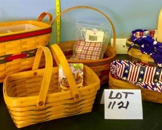 Lot 1121.  Super-Cute Lot of 5 Longaberger Baskets.  All-American Sparkler Basket w/liner (2000), round Easter basket with cherry red picnic pal (10" round, 4.5"h 1992), Picnic Basket w/red and green trim and liner (11x8x6), woven memories basket (10x7x4, 1999), silverware basket w/liner and divider (11x7x6, 2000). Stand not included.  $111.00