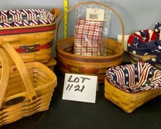 Lot 1121.  Super-Cute Lot of 5 Longaberger Baskets.  All-American Sparkler Basket w/liner (2000), round Easter basket with cherry red picnic pal (10" round, 4.5"h 1992), Picnic Basket w/red and green trim and liner (11x8x6), woven memories basket (10x7x4, 1999), silverware basket w/liner and divider (11x7x6, 2000). Stand not included.  $111.00