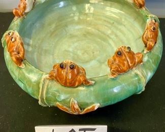 Lot 1123.  Tired of baskets? Here is a sweet 3 footed planter bowl w/8 froggies sitting on the edge.  The bottom has 3 legs/feet.	11"w x6.5"t.  $45  Adorable!