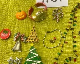 Lot 1134.  Holiday Theme Costume Jewelry. 1 gingerbread watch, 1 candy cane pin, xmas lights necklace, xmas tree pin, xmas tree w/gifts pin, "Damn I've been good!" Pin, Pumpkin pin, 5 pr. Earrings, 1 bracelet, bell pin, rose pin.  Lot 1134.  Holiday Theme Costume Jewelry. 1 gingerbread watch, 1 candy cane pin, xmas lights necklace, xmas tree pin, xmas tree w/gifts pin, "Damn I've been good!" Pin, Pumpkin pin, 5 pr. Earrings, 1 bracelet, bell pin, rose pin.  $30