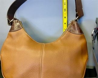 Lot 1184.  1 Charcoal handbag by Baggallini, nylon, great organized storage, 14 x 9.5, 1 Dooney & Bourke brown leather w/dark leather trim 13.5 x 6. $120