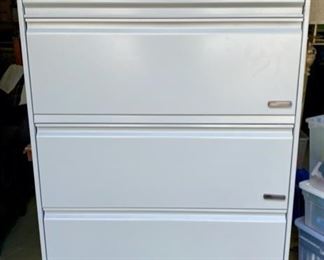 Lot 1248. Hon 5 Drawer Lateral File with Pendaflex System. The top drawer has a pull-up/slide-in door. Tray in the middle. Magnetic label holders for drawers. Lock and key. Excellent condition. 67" tall x 36' wide x 19" deep. Retails for $700. This item like new. $400