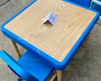 Lot 1252. Fisher-Price child's table with 2 matching chairs. The table has cubbies on sides--looks like it was an art table--condition shows considerable use, but F-P lasts forever! Tabletop 26" square, 20.5" tall. $70