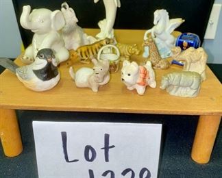 Lot 1229. 14 Miniatures. Gorham Bird, 2 Scottie Dogs, 4 zoo animals, pegasus, dolphin (Lenox), wolf (stone critters), small basket (Limoges), Limoges clock, Lenox elephant.  $85