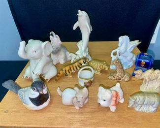 Lot 1229. 14 Miniatures. Gorham Bird, 2 Scottie Dogs, 4 zoo animals, pegasus, dolphin (Lenox), wolf (stone critters), small basket (Limoges), Limoges clock, Lenox elephant.   $85
