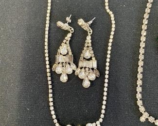 Lot 1292.  $60.00 Rhinestone Jewelry: 2 necklaces,1 Green & clear brooch, 1 bracelet, 1 pr drop earrings. 5 pieces of vintage costume jewelry!