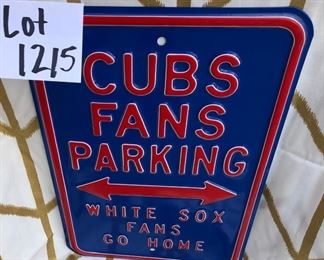 Lot 1215. Set of 3 metal Cubs signs: Cubs fan parking 17-7/8" x 11-7/8"; Prior and Wood street signs 5-7/8" x 36" each.  $60 for the 3