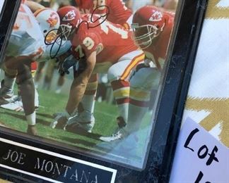 Lot 1220. Joe Montana plaque with signature. 10-1/2" x 13".  Joe's photo was when he was on the Kansas City Team!   $30
