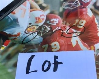 Lot 1220. Joe Montana plaque with signature. 10-1/2" x 13".  Joe's photo was when he was on the Kansas City Team!   $30