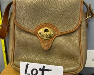 Lot 1238. Dooney & Bourke Crossbody Camel Leather Handbag with some usage $45