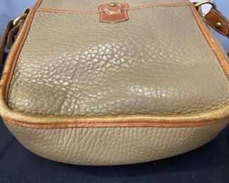 Lot 1238. Dooney & Bourke Crossbody Camel Leather Handbag with some usage on rim. $40