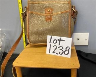 Lot 1238. Dooney & Bourke Crossbody Camel Leather Handbag with some usage. $40