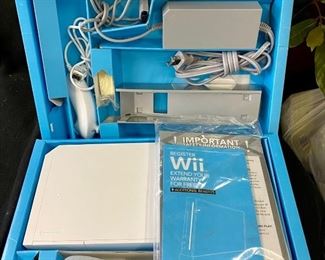 Lot 1269. Buy it Now $75.00 Nintendo Wii Console with 2 Remote Controllers, 2 Nunchucks, Power Cords, TV Adapter, and Original Box Complete 