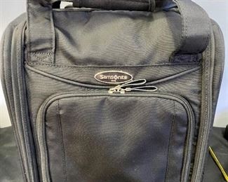 Lot 1310. Samsonite rolling, carryon bag.  Fits under the seat. 13"x16".   $45
