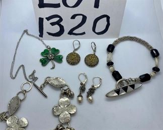 Lot 1320. $56.00.  5 pieces of sterling silver jewelry - 1 sterling and mother of pearl bracelet, 2 pairs of sterling silver pierced earrings, 1 sterling bracelet with 4 leaf clovers and 1 sterling necklace with green 4-leaf clover. 