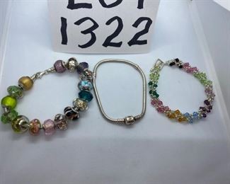 Lot 1322. $75.00.  One sterling silver Pandora bracelet, marked 925 ALE inside clasp, Sterling silver bracelet with 16 Murano Venetian and sterling art glass beads, colorful sterling silver and glass beads. 