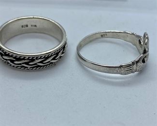 Lot 1328. $95.00. Lovely sterling ring lot.  Tiffany & Co. Sterling Silver Ring - Marked "T and Company 925 Italy", Sterling Silver X's & O's) ring, Sterling Silver Braided ring in larger size and Irish Claddagh ring - larger size.		