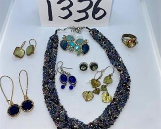 Lot 1336.  $40.00. Six pairs of costume jewelry earrings,  and one knotted blue beaded necklace, and an old ring.  1 Knotted beaded and braded necklace, 1 pr earrings with 5 stones (pierced), 1 cobalt blue drop earrings, 1 gold drop earrings blue stone, 1 green rhinestone studs, 1 green square gem earrings, 1 old ring. 		