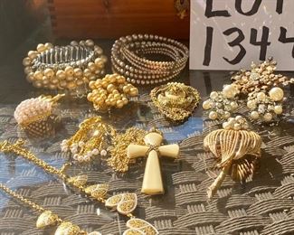 Lot 1344. Wonderful 11 piece lot of vintage jewelry.  11 Antique or Costume jewelry. Super cool rhinestone snowflake pin, Rhinestone and pearl earrings, gold-tone earrings. 2 ivory pearl bracelets, 2 interesting 	vintage shoe or pocket buckles, gold tone and silver heart necklace, pineapple broach... 	$75.00