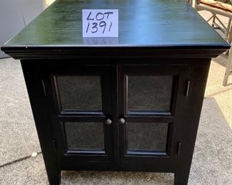 Lot 1391.  $68.00.  Black Ebony Media Cabinet/Side Table with 2 Glass Doors, Top Surface needs TLC, but great bones! 	23"x25"x24"h. 