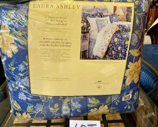 Lot 1407.  $55.00.  Laura Ashley Twin comforter set (comforter, standard pillow sham, bed skirt). Looks pretty close to new. 