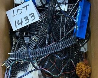 Lot 1433.  $125.00. Huge Lot of HO Scale Trains including: 3 Powered Engines, Box Cars, Tankers and Accessories as well as Track, Transformers, Switches, and Trestle Bridge.	