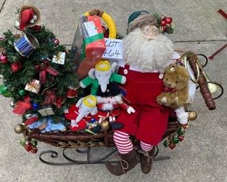 Lot 1464. $125.00.  Giant Sleigh with Jolly old St. Nick, Sleigh is filled with real gifts, Barbie, Hot wheels, stuffed animals, baby doll. so much fun	30"wx34"tx15"d