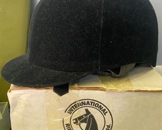 Lot 1504. Our Price $50.00  Black International Riding Helmet, Velvet from 1995. Size 7 1/4. In box , excellent condition ( New on Amazon $209). 