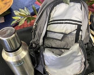 Lot 1482.  $65.00.  The North Face Borealis in Orange and Gray and Stanley Stainless Steel Thermos		
