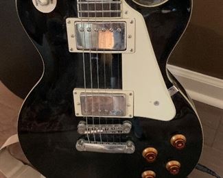 #35	Les Paul Epiphone guitar with stand and hard case	SOLD
