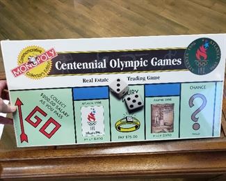$95 - Brand new Collectors item!! Still in shrink wrap. Monopoly Centennial Olympic Games game. Gold holograph of authenticity on back.