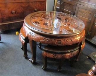 $950 - (photo #3) Hand carved, Chinese Tea Table with four quadrant stools in solid hardwood Mahagony. Glass top. Impressive centerpiece to living room, corporate lobby, or office. Table and 4 seats in this set. Previous photos are of table and seats. TWO of these Tea Table sets are available. Take both for $1800.
