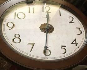 $275 - (photo #2) Howard Miller Clock Table. Galliano. Oval. Beauty of a clock with the functionality of a table. Aged espresso finish. Sculpted metal legs finished in antique gold. Excellent condition.