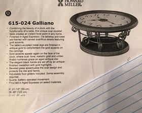 $275 - (photo #3) Howard Miller Clock Table. Galliano. Oval. Beauty of a clock with the functionality of a table. Aged espresso finish. Sculpted metal legs finished in antique gold. Excellent condition.