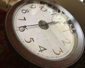 $275 - (photo #1) Howard Miller Clock Table. Galliano. Oval. Beauty of a clock with the functionality of a table. Aged espresso finish. Sculpted metal legs finished in antique gold. Excellent condition.