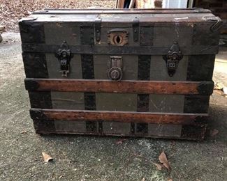 Antique Steamer Trunk. (photo #1) Collector’s item. Believed to be post Civil War. Wood & metal. Flat top, body supported with wood slats, hasp lock, triangular hinges, casters, leather handles, paper lining which was common through the late 1800s. - $300.