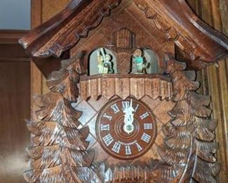 RARE (Photo #1) $380 - Goebel Hummel Dancing Figurines Musical Cuckoo Clock. Regula German Black Forest animated Swiss musical chalet Cuckoo Clock with dancing Hummel Goebel figurines. Deeply carved with a classic chalet design and wonderful detail. But what really makes this cuckoo clock stand out is the rare and adorable Hummel characters ! (see pics). Each figurine is stamped M.J. Hummel Goebel. The maker on this stunning Cuckoo Clock is Regula and is stamped 25 / 1-P. (not sure but assuming that this is the model and or the mechanism number.) Other numbers found on the brass mechanism are stamped G.M. 186 this may be the patent numbers for the mechanism. Also stamped, Made in Germany. Clock face, hands, pendulum, pine cone weights and figurines are in very good condition. The only minor cosmetic issue on this clock is down at the base. The small birds have chipped/broken and repaired wing tips. These are very small birds so you really don't notice it unless you get up very close