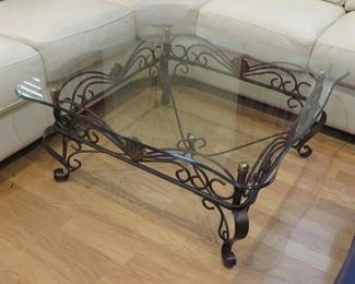 Glass top cocktail table