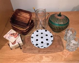 Assorted Kitchen Lot - coaster, wood bowls, martini pitcher, polka dot plates (6), wood cutting board, pair of votives and basket - Price $95