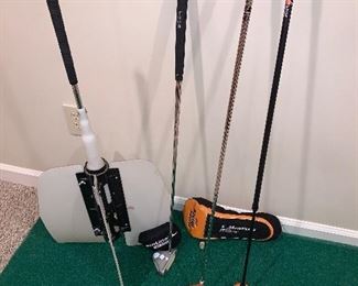 Assorted golf miscellaneous - practice mat, assorted practice clubs, driver, travel golf bag cover- all $95