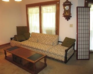 Fun couch with a built in side table.  Remove the end cushion and you have another side table.