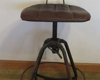 Toledo Metal Company drafting stool.  Has some of it's original green paint and just the right amount of rust.  The leather covers are removable.