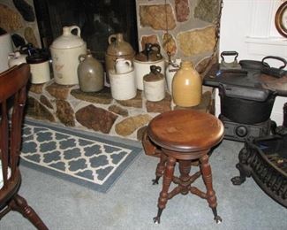 Piano stool, 1 of 4 small woodstove, some of many pieces of stoneware.