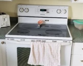Maytag electric range; GE Profile microwave oven