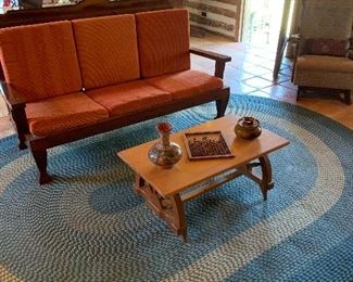 Sofa w/ red cushions SOLD
Wagon wheel Coffee Table $75.00
Oval Braided Rug 
$100.00